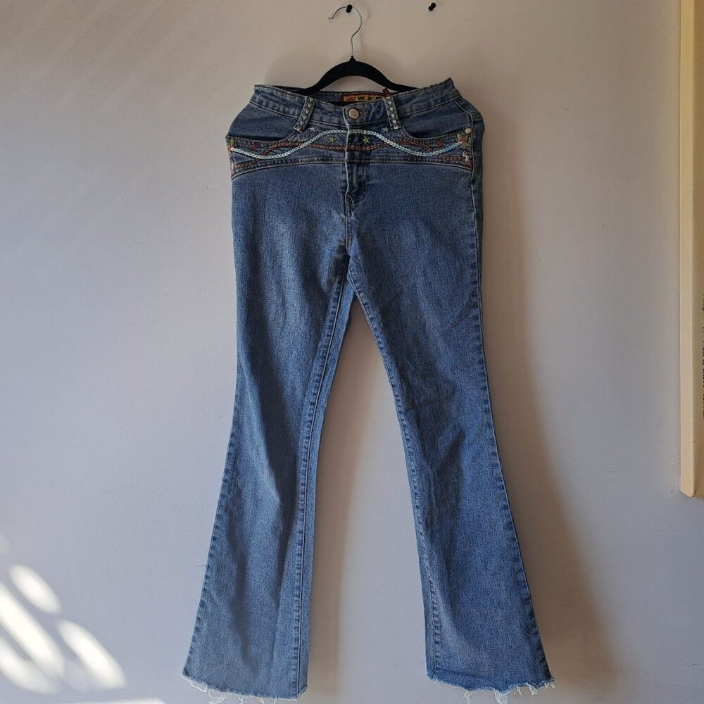 Light blue, vintage flair jeans with flower designs